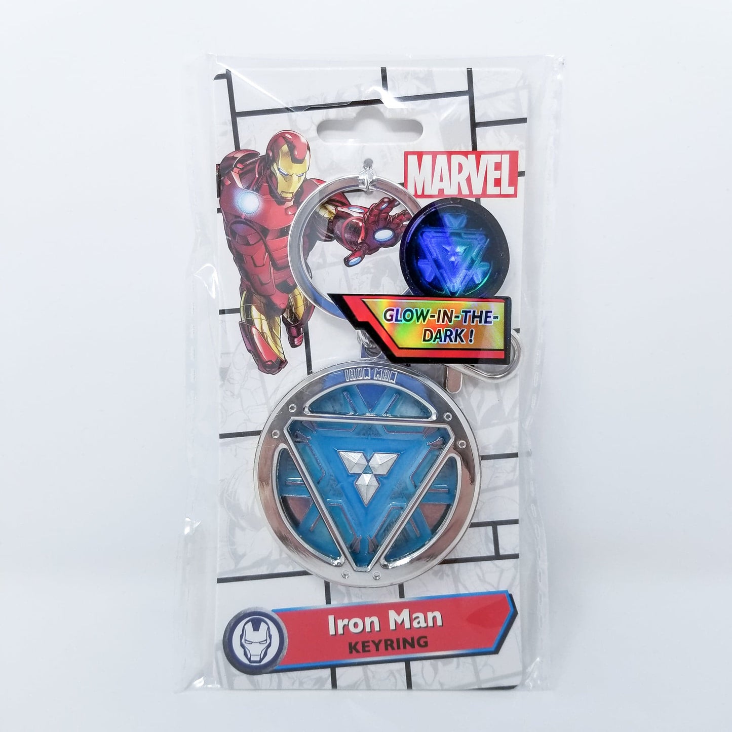 Iron Man Glow-In-The-Dark Pewter Arc Reactor Keychain. In Celebration of Tony Stark’s Iron Man as seen in the Marvel Studios Avengers films, this oversize pewter Arc Reactor glow-in-the-dark metal keychain features the Arc Reactor powering Tony’s chest and power suit in Iron Man 3. 2 inches across & nearly 1/2 inch thick! Features “Iron Man” logo on the back Includes stainless steel keyring and clip Blue Glow-in-the-Dark effect! Carry your own Proof that Tony Stark Has a Heart